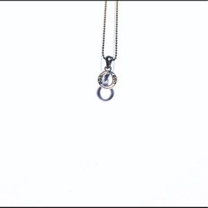 Silver letter “O” necklace.